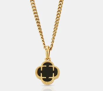 Gold pendant necklace with black clover-shaped charm