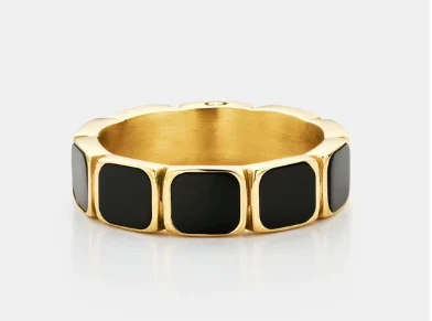 Gold ring with black enamel tile pattern